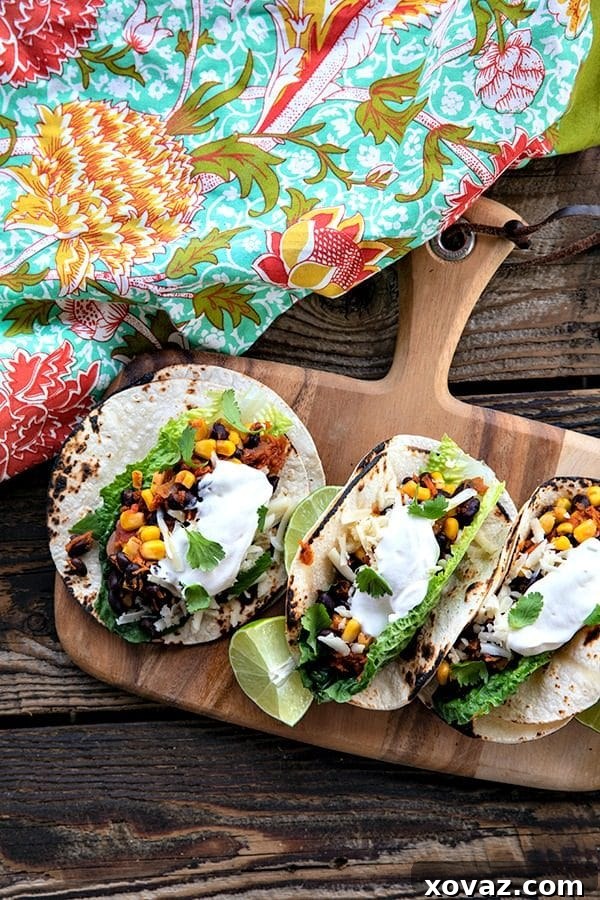 Delicious Black Bean Tacos Ready in 10 4 Arrangement of black bean and corn tacos with fresh garnishes like cilantro and cheese, ready to serve.