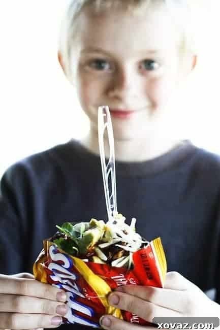 Delicious Pulled Pork Walking Tacos, a portable and easy meal for any occasion.