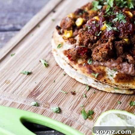 The Ultimate Vegan Double Stack Bean and Mexican Crumbles Tostadas
