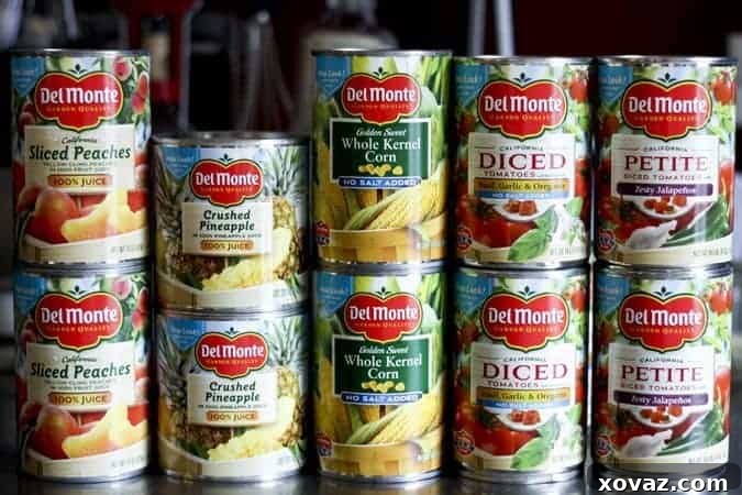 Del Monte Garden Pantry offerings and Pineapple Salsa ingredients on a wooden table