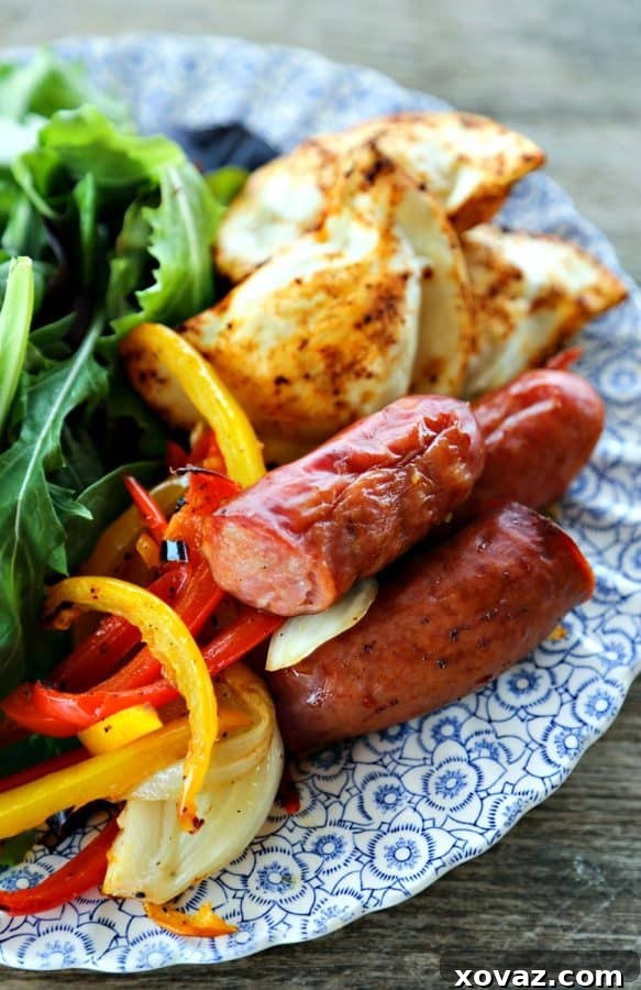 Kielbasa and Pierogies Sheet Pan Meal with juicy roasted kielbasa, crisp tender peppers and onions and puffy, potato filled pierogies.