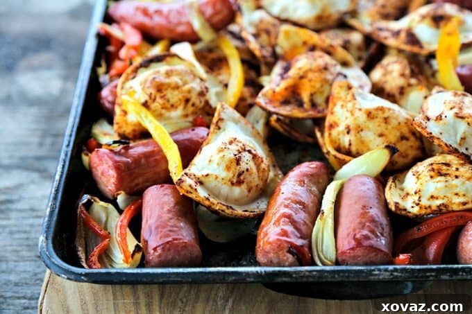 Kielbasa and Pierogies Sheet Pan Meal with juicy roasted kielbasa, crisp tender peppers and onions and puffy, potato filled pierogies.