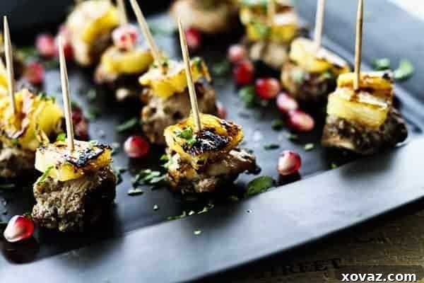 60 Ultimate Game Day Snacks 3 Jerk Chicken Bites with Rum Glazed Pineapple, a perfect spicy-sweet appetizer for parties.