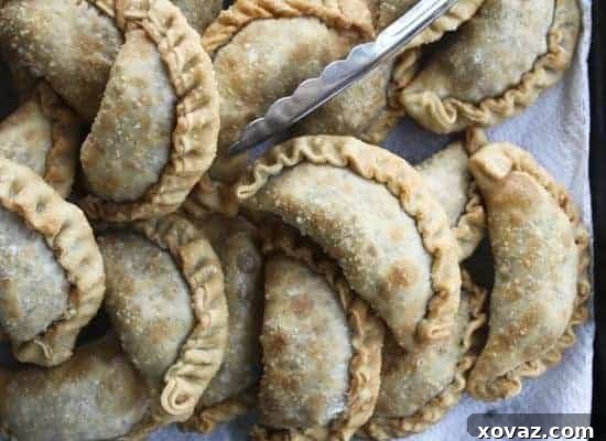 60 Ultimate Game Day Snacks 7 Cincinnati Chili Empanadas, crispy deep-fried pockets filled with savory chili.