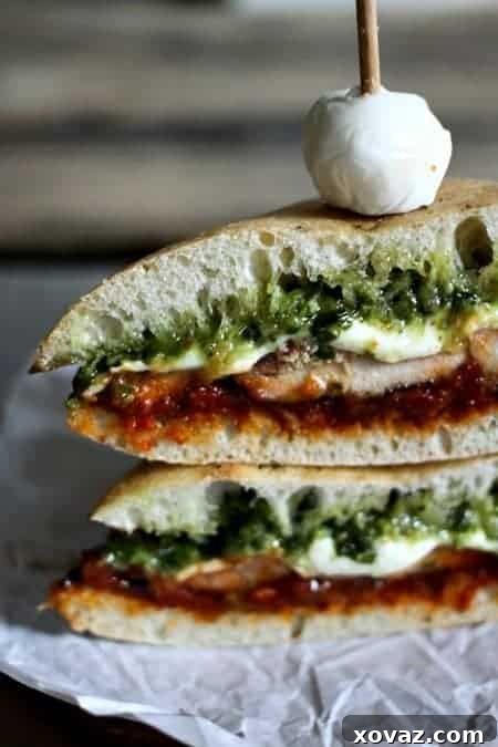 Irresistible Grilled Chicken Melt featuring homemade Sun-Dried Tomato Spread and vibrant pesto. Perfect sandwich enhancer.