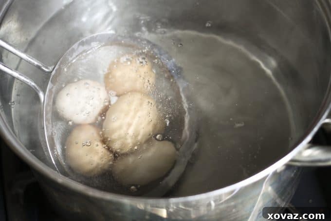 The unique blanching trick for eggs: eggs in their shells submerged in boiling water for 10 seconds.