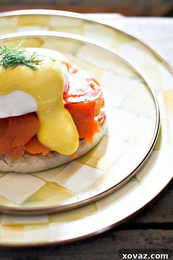 A close-up shot of a perfectly poached egg being lifted from the water with a slotted spoon, ready for serving.