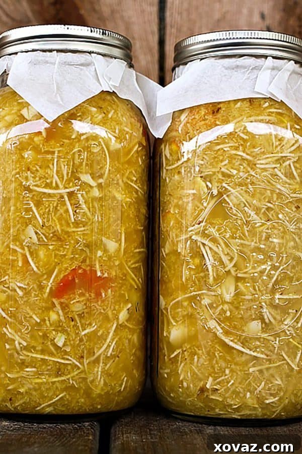 Homemade Fire Cider Elixir 5 Freshly chopped ginger and turmeric roots, essential ingredients for homemade Fire Cider, showcasing their vibrant colors and powerful health benefits.