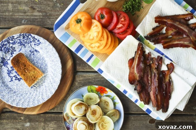 Close-up of Welsh Rarebit served on toasted baguette, topped with golden-brown pan-fried onions and cheese sauce.