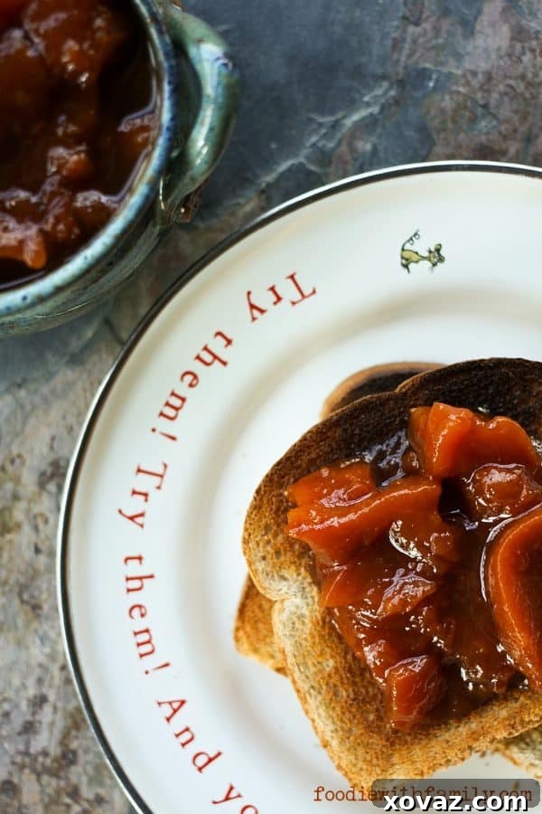 Multiple jars of Ginger Peach Preserves cooling on a counter after canning, showcasing a successful homemade preserve batch from foodiewithfamily.com