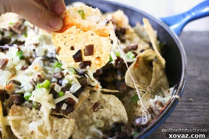 Ultimate Brisket Nachos 4 Beef, cheese, onions, peppers, and chips, Cheesesteak Nachos are comfort food deluxe from foodiewithfamily.com