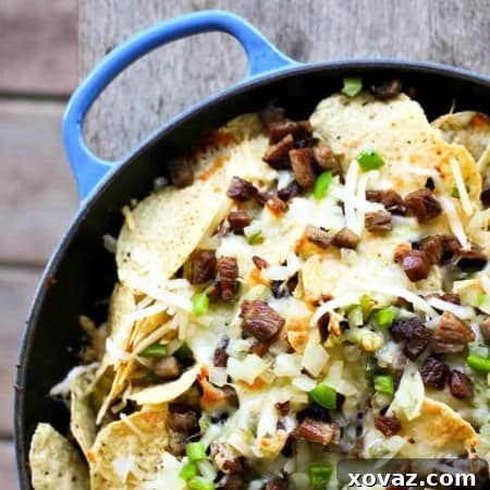Cheesesteak Nachos are comfort food deluxe from foodiewithfamily.com beef, cheese, onions, peppers