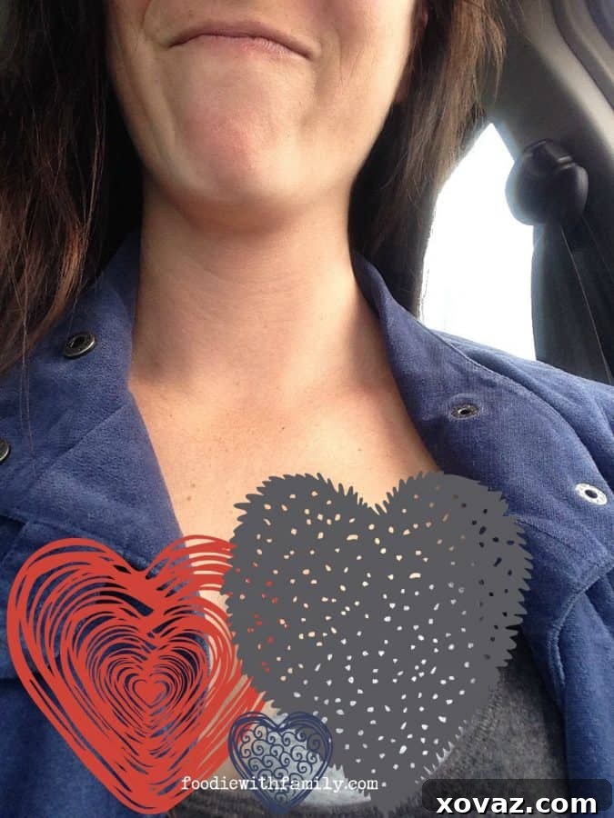 A humorous photo showing a wardrobe malfunction with an oversized tank top, humorously censored for modesty