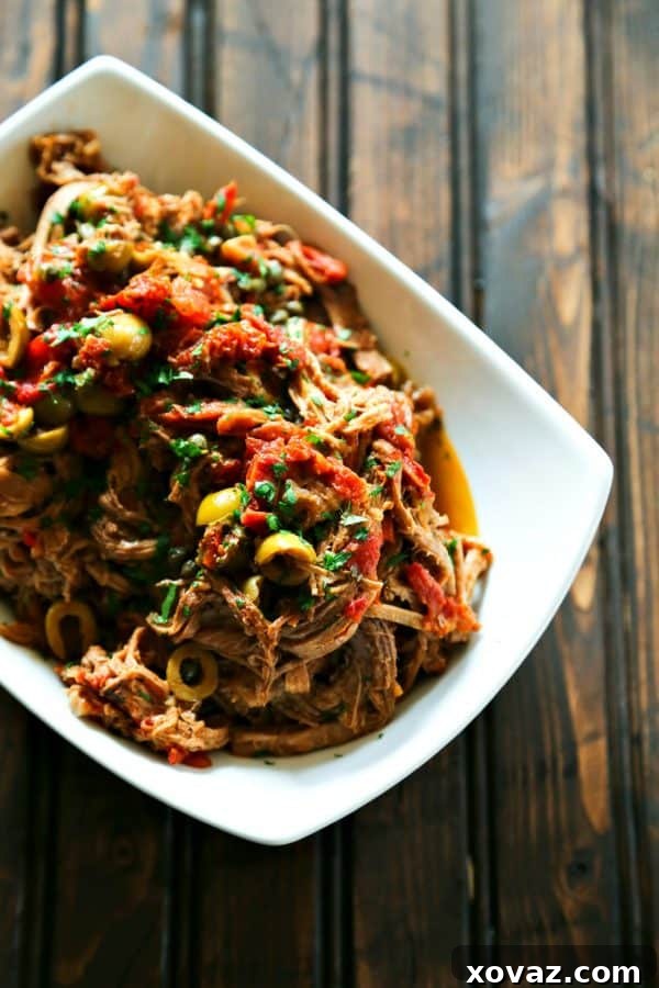Fall-Apart Slow Cooker Shredded Beef 2 Slow Cooker Italian Shredded Beef full of sun dried tomatoes, wine, garlic, fire roasted tomatoes, olives, and capers from foodiewithfamily.com