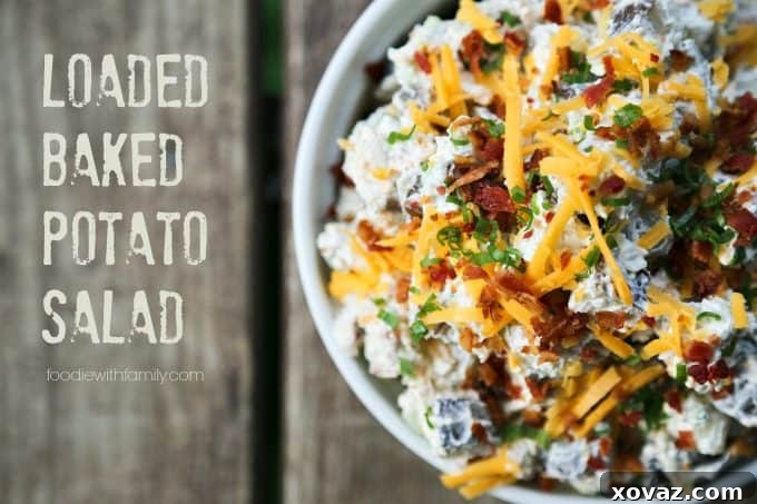Ultimate Baked Potato Salad 2 Loaded Baked Potato Salad: A creamy, savory side dish with tender potatoes, crispy bacon, cheddar cheese, and green onions, perfect for summer gatherings.