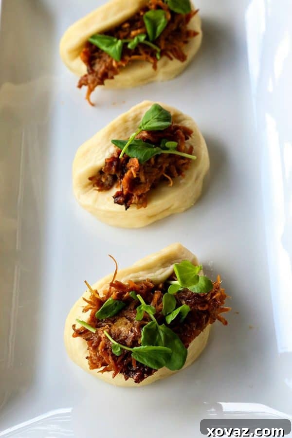 Learn to make incredibly soft, pillowy homemade Bao Buns – easier than you think! foodiewithfamily.com