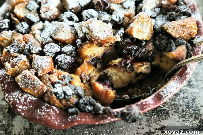 Rich, creamy, and souffle-like Chocolate Cherry Doughnut Bread Pudding with dark chocolate and sweet black cherries.