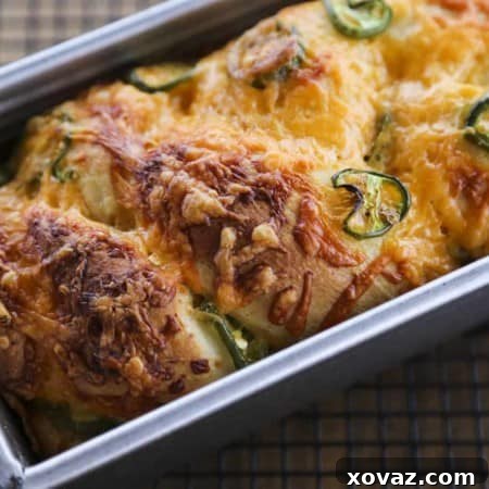 A beautiful loaf of Jalapeno Cheddar Bread, showcasing its perfectly golden crust and the inviting texture of the crumb.