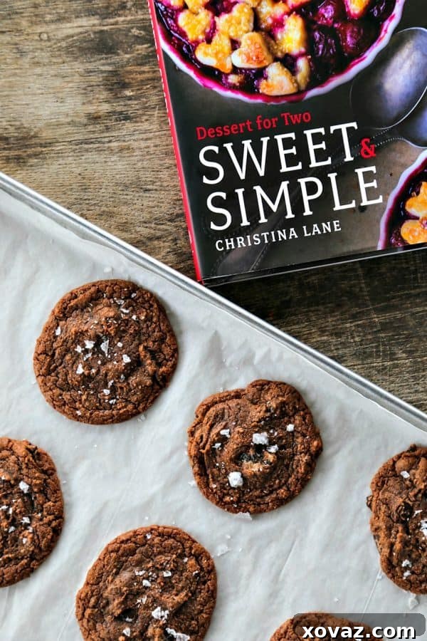 Close-up of freshly baked Easy Double Chocolate Nutella Cookies, lightly dusted with sea salt. A straightforward recipe for delicious homemade treats.