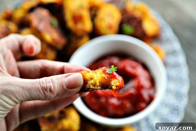 Crispy Bacon Cheddar Cauliflower Bites 3 Healthy and delicious! These Bacon Cheddar Cauliflower Tots are perfectly baked, boasting a wonderfully crispy crust and a cheesy, tender inside. Ideal for a low-carb snack or side dish.