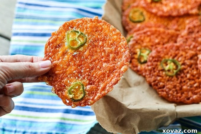 Cracklingly crisp, spicy 2-Ingredient Jalapeño Popper Crisps are a fabulously simple cracker for soups, stews, and salads. Bonus: They're low-carb, too!