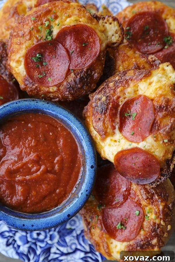 Cheesy Pepperoni Bialys Delights 4 A stack of warm Pepperoni Pizza Bialys, ready to be served.
