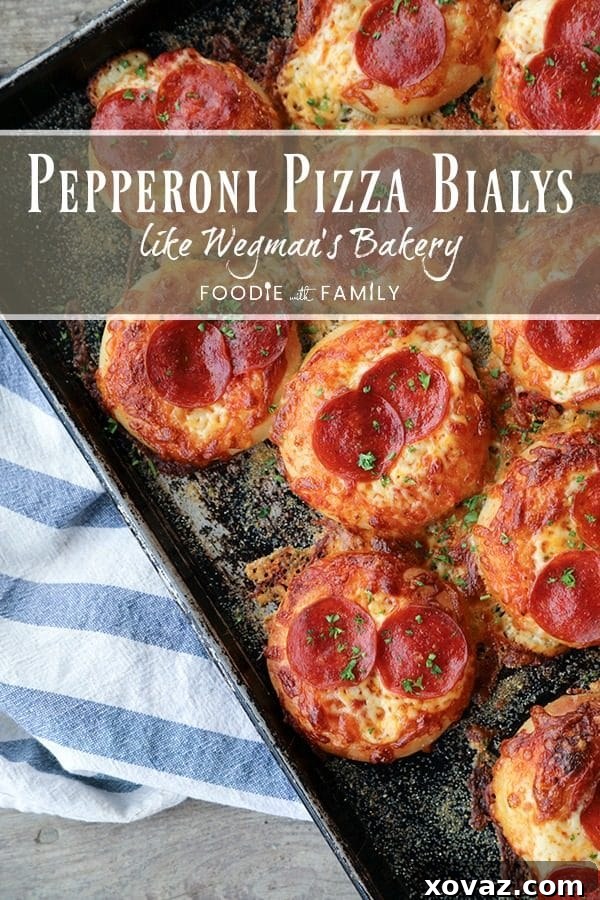 Cheesy Pepperoni Bialys Delights 8 A plate full of savory Pepperoni Pizza Bialys, fresh from the oven, offering a delightful and easy meal option.