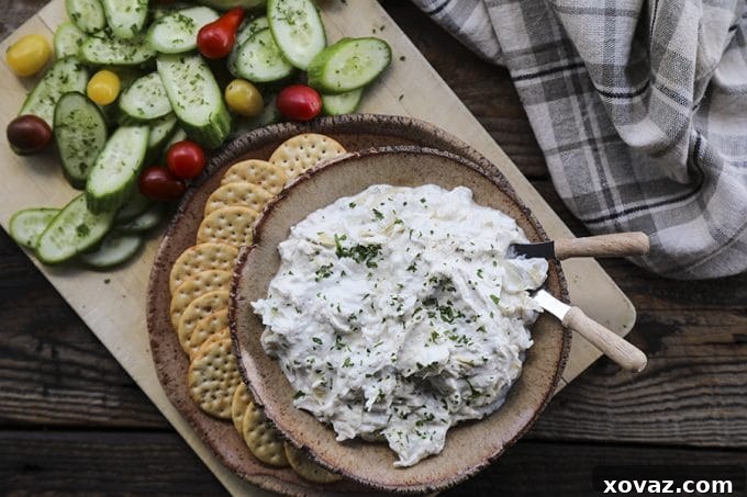 Velvety Roasted Garlic Artichoke Goat Cheese Dip 2 A bubbling pot of Roasted Garlic Artichoke Goat Cheese Fondue, perfect for dipping crusty bread.
