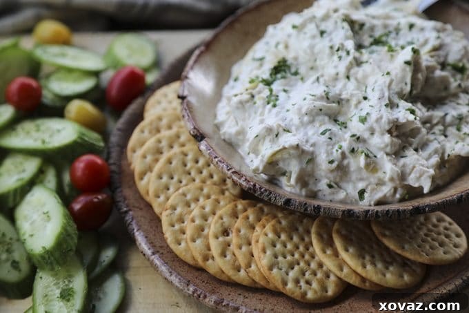 Velvety Roasted Garlic Artichoke Goat Cheese Dip 4 Goat cheese fondue served with a variety of dippers like vegetables and pretzels.