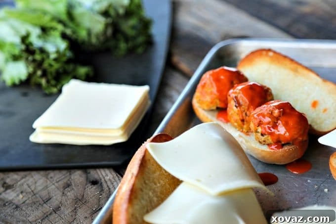 Legendary Buffalo Chicken Meatball Hoagie 4 Delicious baked Buffalo chicken meatballs, bursting with flavor from sautéed vegetables and blue cheese, served on toasted sub rolls with perfectly melted Land O Lakes Deli American cheese. A hearty and satisfying game day recipe.