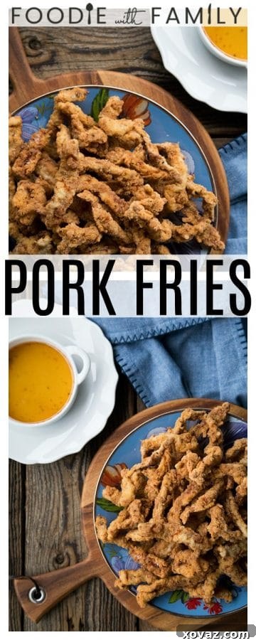 A close-up of a serving of Crispy Pork Tenders, showing the golden-brown crust and inviting texture, ready for a dip.