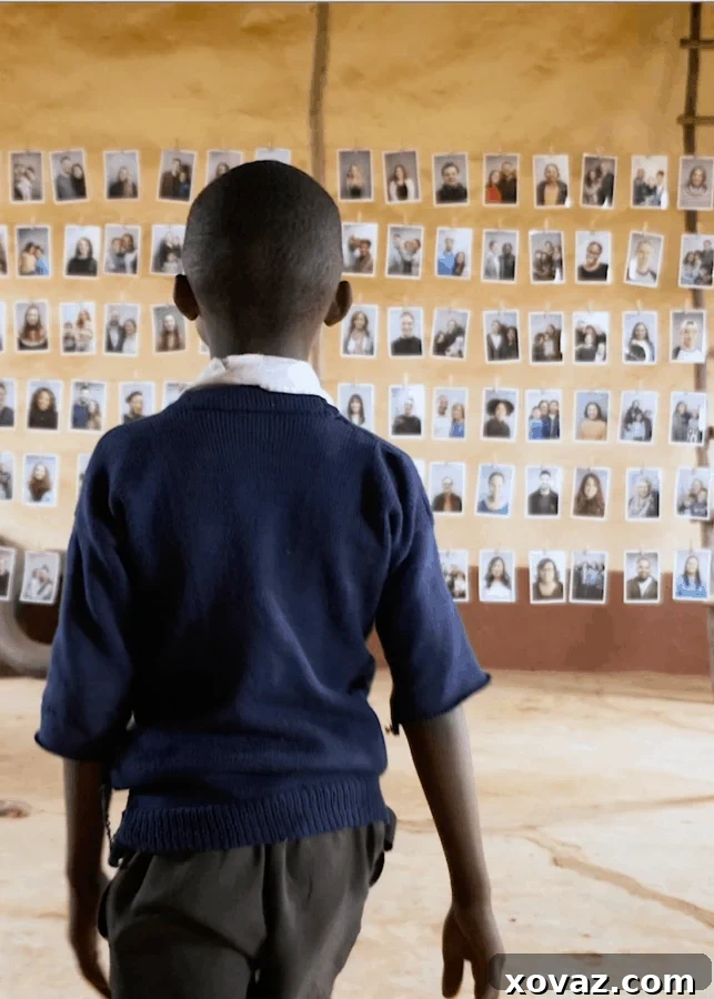 A child in a World Vision community thoughtfully reviewing photos of potential sponsors, an act of empowered choice through the #Chosen program.