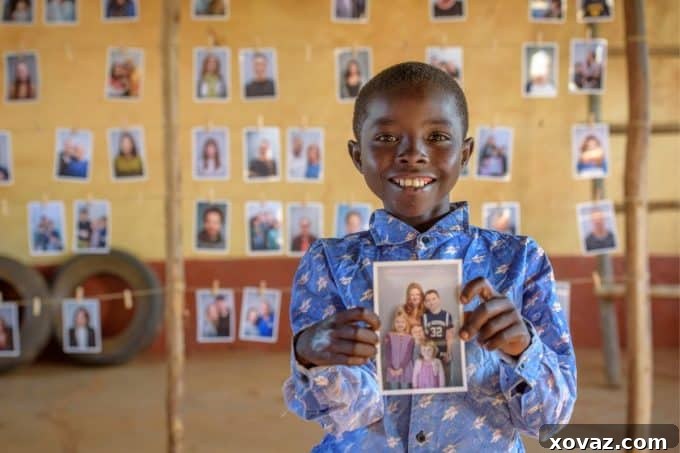 A group of World Vision staff and community members assisting children in the #Chosen program as they joyfully select their sponsors.