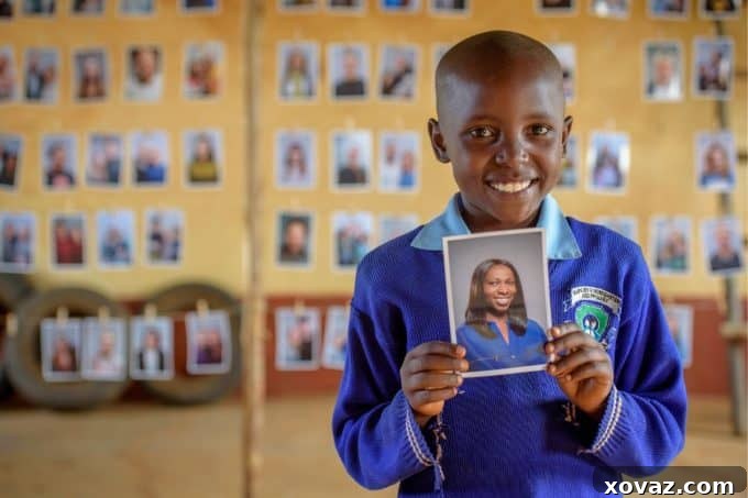 A child joyfully selecting a sponsor's photograph from a display board, symbolizing agency and hope through World Vision's #Chosen program.