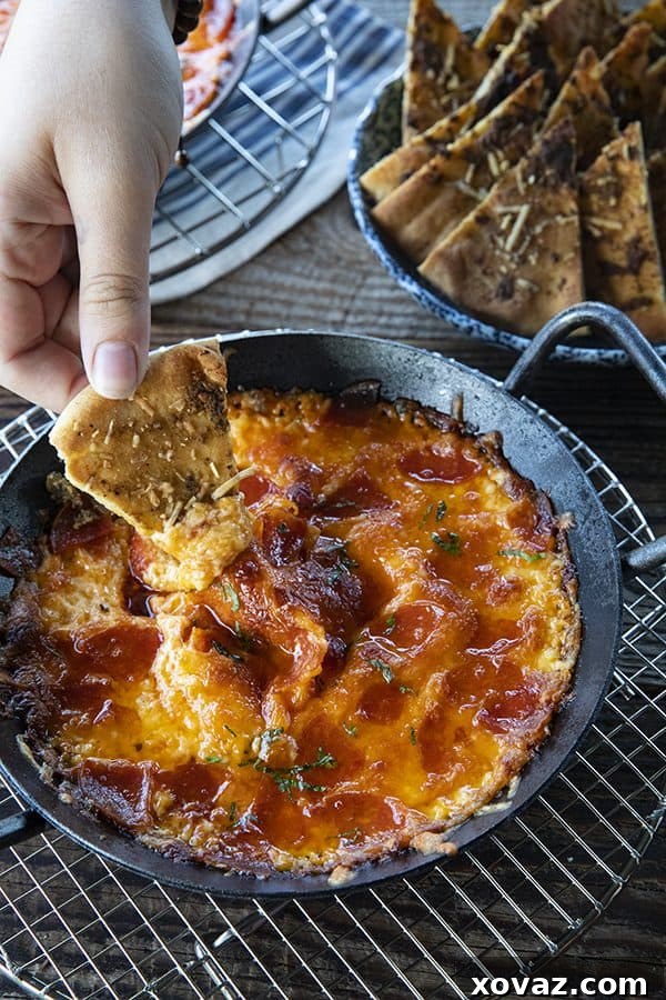 Close-up of bubbling Pizza Dip with melted cheese and pepperoni
