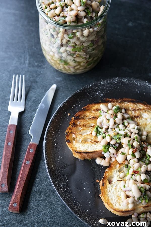 Mediterranean White Bean Salad 2 Full of fresh herb flavors, White Bean Salad comes together in a breeze. Made with canned or home cooked white beans, abundant fresh herbs, and a simple vinaigrette dressing, this salad is delicious as a light lunch on its own or as a side dish with all your favorite entrees.