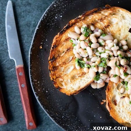 Full of fresh herb flavors, White Bean Salad comes together in a breeze. Made with canned or home cooked white beans, abundant fresh herbs, and a simple vinaigrette dressing, this salad is delicious as a light lunch on its own or as a side dish with all your favorite entrees. 