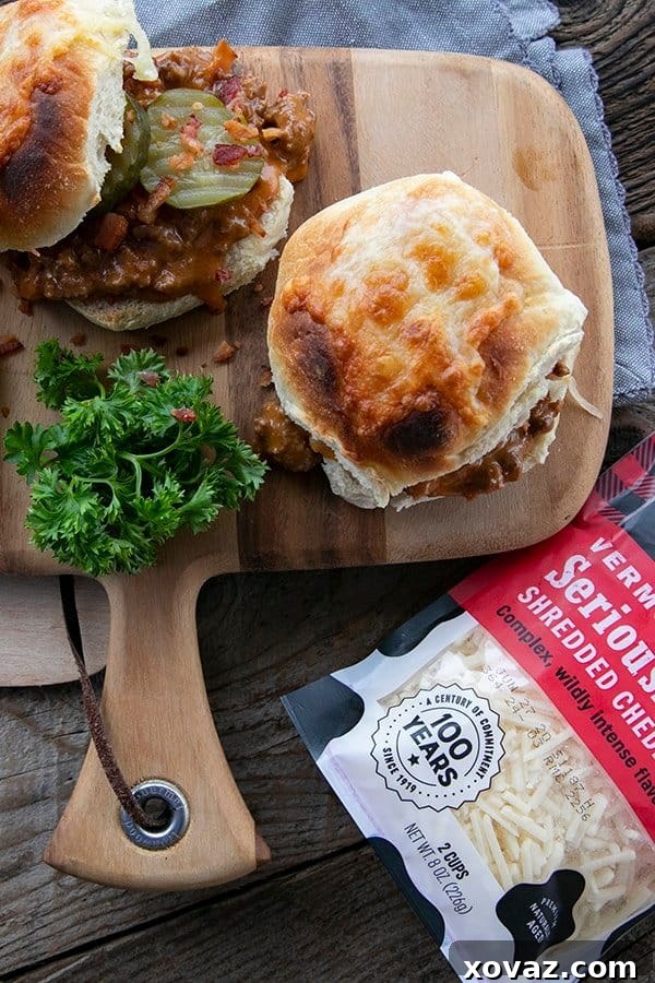 Flavor-Packed Homemade Sloppy Joes 2 A rich tomato gravy featuring generous amounts of melted Cabot cheese and crispy chopped bacon, served on a toasted bun with tangy dill pickles. This dish offers the comforting taste of a bacon cheeseburger with an added layer of homemade warmth.