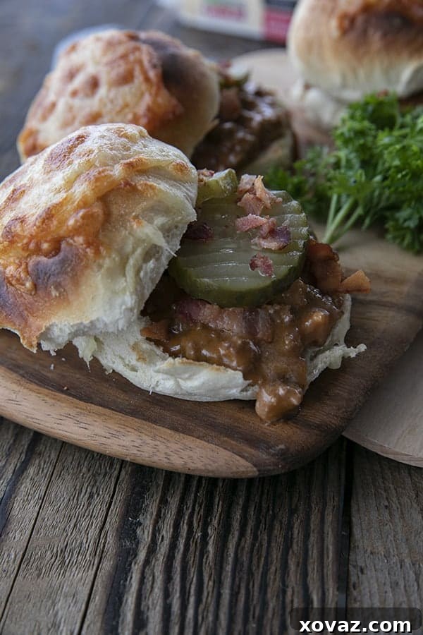 Flavor-Packed Homemade Sloppy Joes 4 A rich tomato gravy featuring generous amounts of melted Cabot cheese and crispy chopped bacon, served on a toasted bun with tangy dill pickles. This dish offers the comforting taste of a bacon cheeseburger with an added layer of homemade warmth.