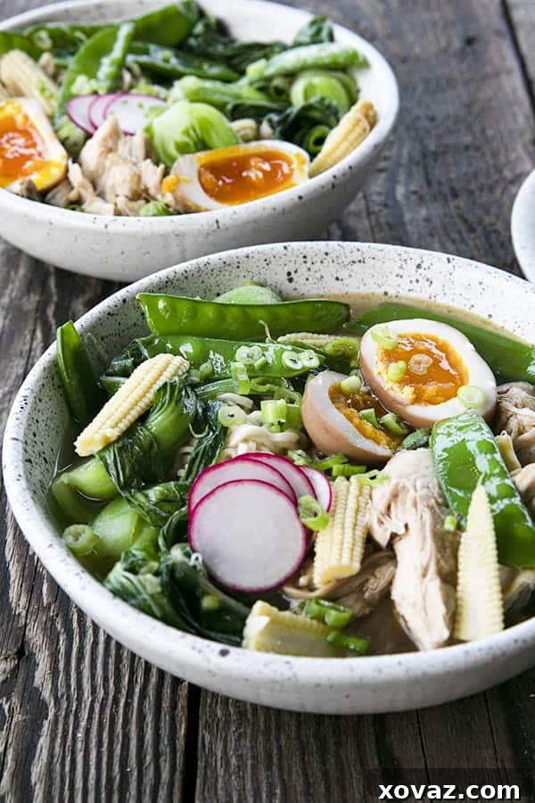 Ultimate Instant Pot Ramen 4 Instant Pot Chicken Ramen with jammy egg, baby corn, pea pods, bok choy, mushrooms, and radishes.
