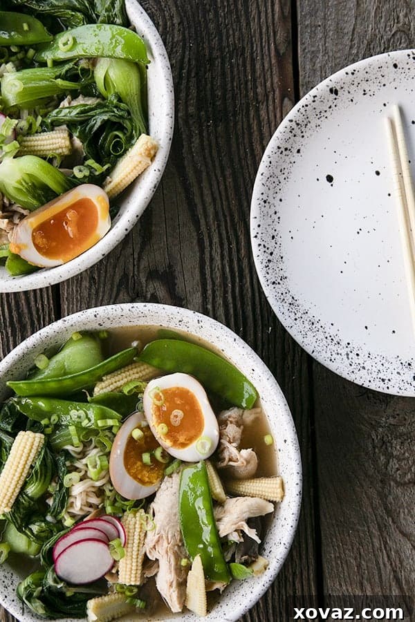 Ultimate Instant Pot Ramen 5 Instant Pot Chicken Ramen with jammy egg, baby corn, pea pods, bok choy, mushrooms, and radishes.