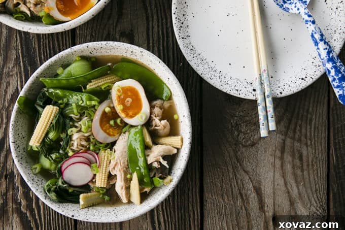 Ultimate Instant Pot Ramen 6 Instant Pot Chicken Ramen with jammy egg, baby corn, pea pods, bok choy, mushrooms, and radishes.