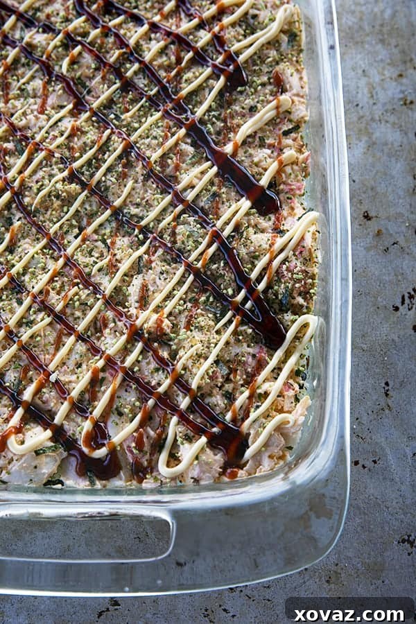 Sushi Bake ready to go into the oven with sauce.