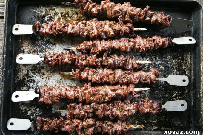 Individual skewers of marinated flat iron steak, perfectly portioned for grilling.