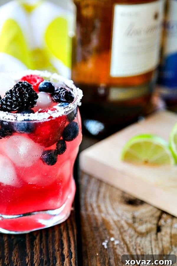 Tart and sweet, refreshing Berry Kombucha Margaritas, a modern twist on the classic, perfect for hot days and pairing with Korean BBQ.