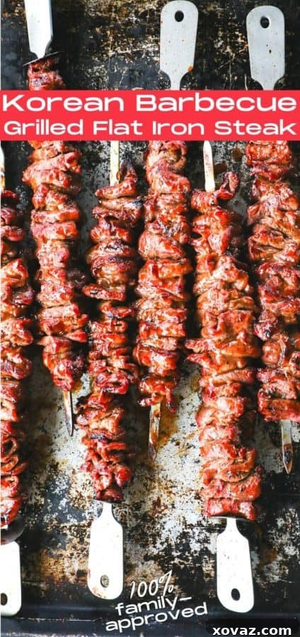 A beautifully presented serving of Korean Barbecue Grilled Flat Iron Steak, garnished and ready for enjoyment.