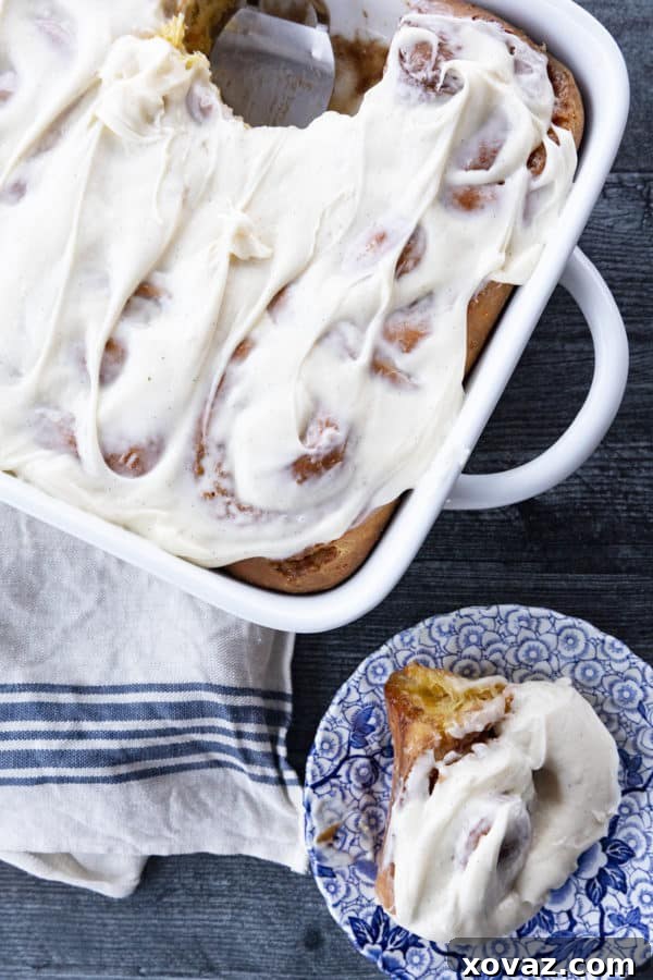 Close-up of Carrot Cake Cinnamon Rolls dough, showing finely shredded carrots before rolling around a spiced buttery brown sugar filling.