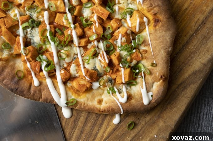 Bold Buffalo Chicken Flatbread 6 The Buffalo chicken mixture, with chicken cubes coated in spicy sauce, ready for the flatbread.