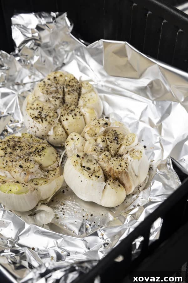 Creamy Air Fryer Roasted Garlic 5 Tender, mellow, buttery roasted cloves of garlic. This easy air fryer recipe will set you up with a generous amount of golden brown, sweet, roasted garlic in far less time than traditional oven roasted garlic.