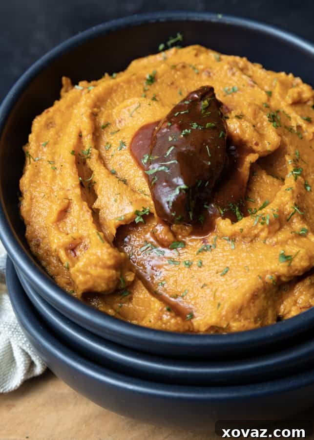 Sweet Potato Chili Delight 3 Close-up of freshly roasted sweet potatoes on a sheet pan, ready for mashing into a spicy dish.